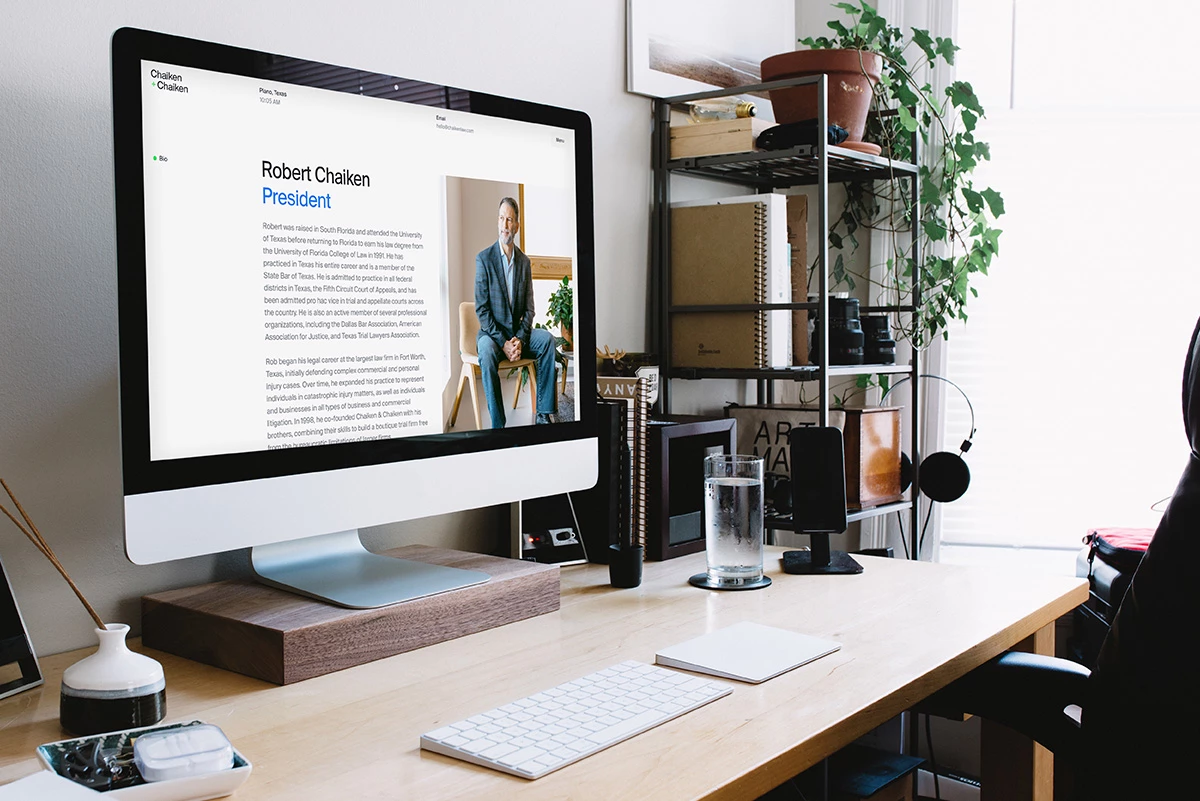 Chaiken & Chaiken attorney biography page for president Robert Chaiken displayed on a desktop iMac