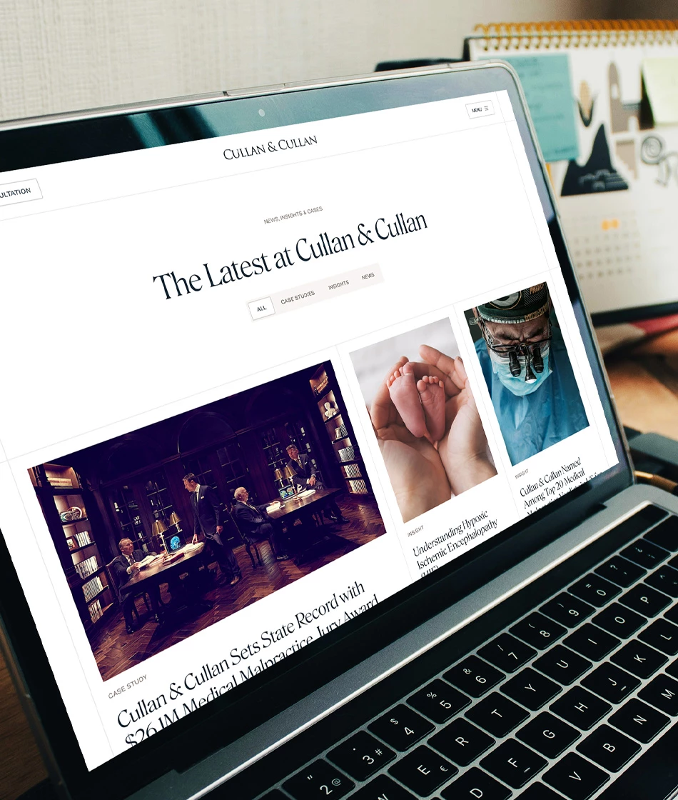 Cullan &amp; Cullan news and insights page design on laptop