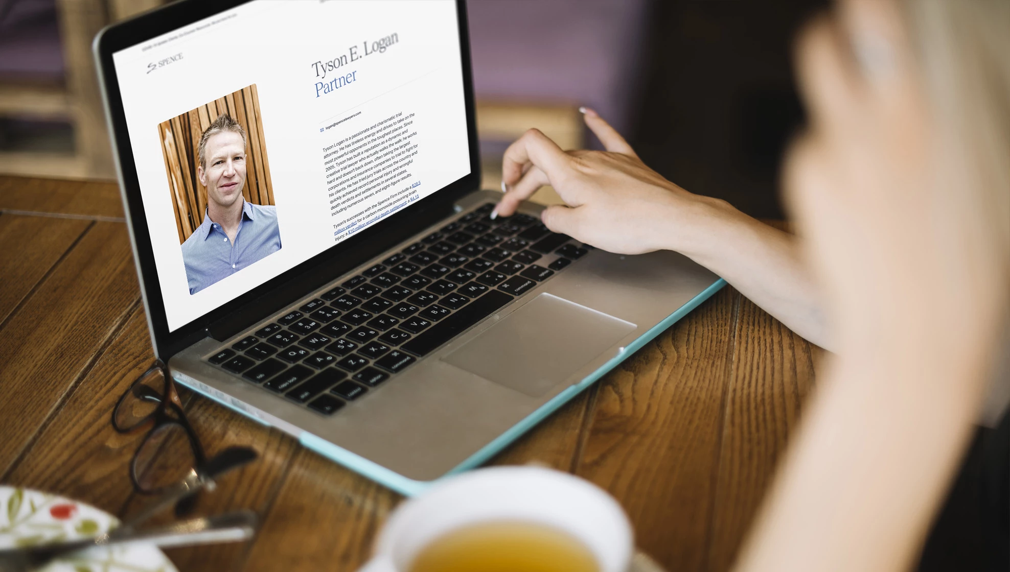 The Spence Law Firm bio page design on laptop